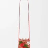 Aardbeienzakje met trekkoord van klassiek kalfsleer en raffia Aardbeienzakje met trekkoord van klassiek kalfsleer en raffia