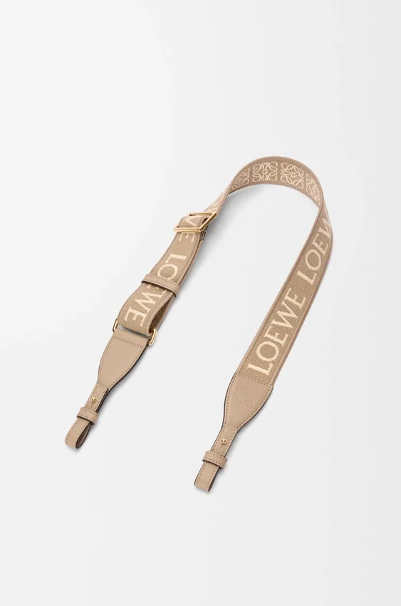 Anagram-loop met lus van jacquard en kalfsleer Anagram-loop met lus van jacquard en kalfsleer