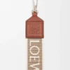 Anagram-riem van jacquard en kalfsleer