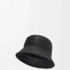 Buckethoed van raffia en kalfsleer Buckethoed van raffia en kalfsleer
