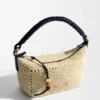 Cala-minitassen van klassiek kalfsleer en raffia