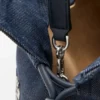 Cats medium Flamenco-clutch van geborduurd denim Cats medium Flamenco-clutch van geborduurd denim