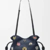 Cats medium Flamenco-clutch van geborduurd denim Cats medium Flamenco-clutch van geborduurd denim