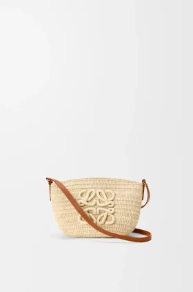 Eclipse-pochette van raffia en kalfsleer
