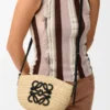 Eclipse-pochette van raffia en kalfsleer