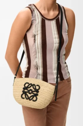 Eclipse-pochette van raffia en kalfsleer