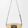 Eclipse-pochette van raffia en kalfsleer