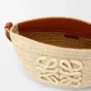 Eclipse-pochette van raffia en kalfsleer