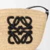 Eclipse-pochette van raffia en kalfsleer