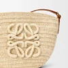 Eclipse-pochette van raffia en kalfsleer