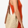 Kleine Punch Hole Hobo van raffia en kalfsleer Kleine Punch Hole Hobo van raffia en kalfsleer
