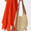 Kleine Punch Hole Hobo van raffia en kalfsleer Kleine Punch Hole Hobo van raffia en kalfsleer
