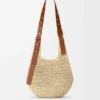 Kleine Punch Hole Hobo van raffia en kalfsleer Kleine Punch Hole Hobo van raffia en kalfsleer