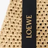 Kleine Punch Hole Hobo van raffia en kalfsleer Kleine Punch Hole Hobo van raffia en kalfsleer