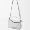 Kleine Puzzle Edge-tas van gelamineerd lamsleer Kleine Puzzle Edge-tas van gelamineerd lamsleer
