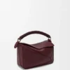 Kleine Puzzle-tas van glad kalfsleer en nappa-lamsleer Kleine Puzzle-tas van glad kalfsleer en nappa-lamsleer