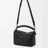 Kleine Puzzle-tas van glad kalfsleer en nappa-lamsleer Kleine Puzzle-tas van glad kalfsleer en nappa-lamsleer