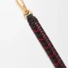 Korte riem met pijlmotief van kalfsleer Korte riem met pijlmotief van kalfsleer