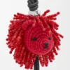 Lion Head-bedeltje van gehaakt materiaal en kalfsleer Lion Head-bedeltje van gehaakt materiaal en kalfsleer