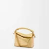Mini Puzzle Edge-tas van gelamineerd lamsleer Mini Puzzle Edge-tas van gelamineerd lamsleer