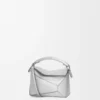 Mini Puzzle Edge-tas van gelamineerd lamsleer Mini Puzzle Edge-tas van gelamineerd lamsleer