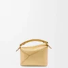 Mini Puzzle Edge-tas van gelamineerd lamsleer Mini Puzzle Edge-tas van gelamineerd lamsleer