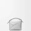 Mini Puzzle Edge-tas van gelamineerd lamsleer Mini Puzzle Edge-tas van gelamineerd lamsleer