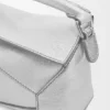 Mini Puzzle Edge-tas van gelamineerd lamsleer Mini Puzzle Edge-tas van gelamineerd lamsleer