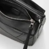Panta kleine Puzzle-tas van glanzend kalfsleer Panta kleine Puzzle-tas van glanzend kalfsleer