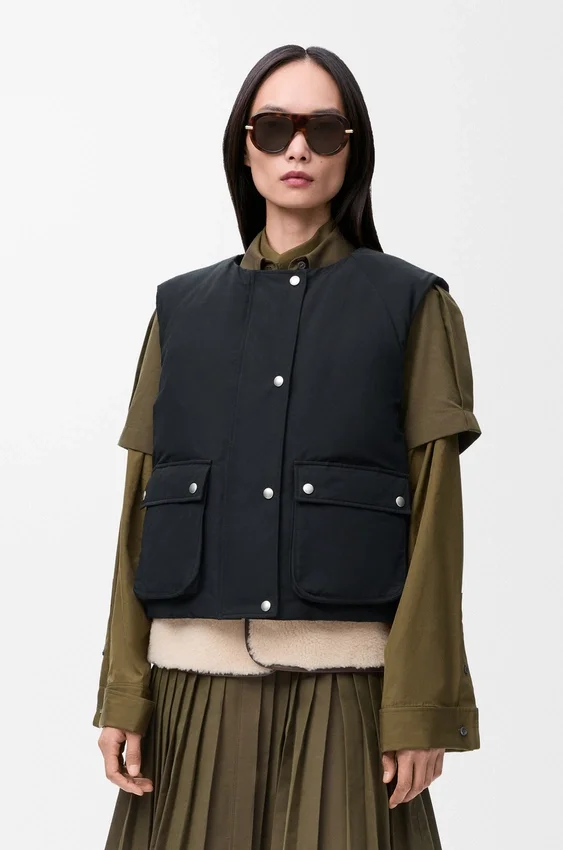 Puffer-vest van een mix van schapenvacht en katoen Puffer-vest van een mix van schapenvacht en katoen