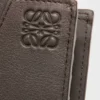 Puzzle-portemonnee met twee vouwen voor munten, van klassiek kalfsleer Puzzle-portemonnee met twee vouwen voor munten, van klassiek kalfsleer