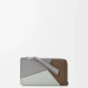 Puzzle-portemonnee voor munten en pasjes van klassiek kalfsleer Puzzle-portemonnee voor munten en pasjes van klassiek kalfsleer