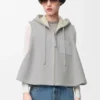Vest met capuchon van schapenvacht Vest met capuchon van schapenvacht